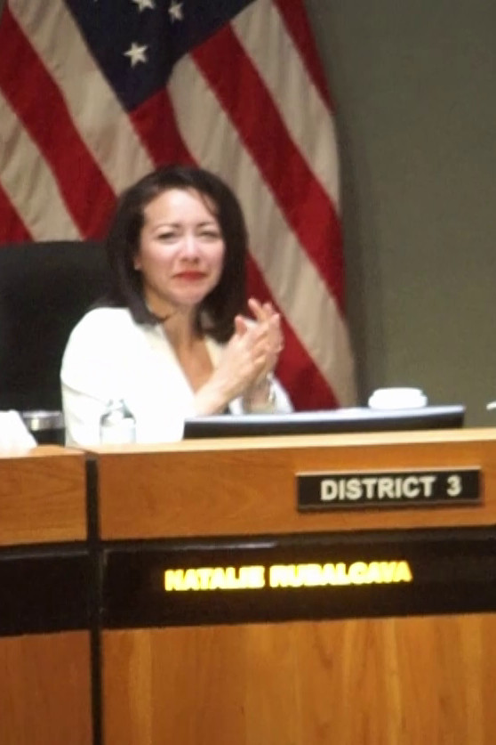 Councilmember Rubalcava sanitizing her hands.